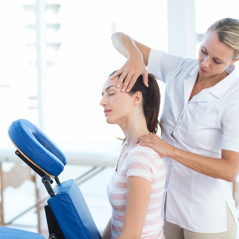 Woman having neck massage in medical office